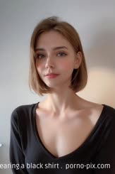 a woman with a short haircut wearing a black shirt . 