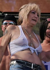Sunny Day at the Beach: A group of friends, including a busty blonde woman, enjoy a day of fun andâ–Œ