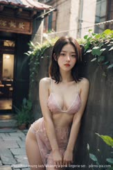 a beautiful young lady wearing a pink lingerie set . 