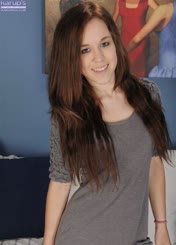 Sultry Brunette with Long Hair Posing for a Sensual Photo