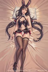 a sexy girl laying in bed with her legs crossed . 