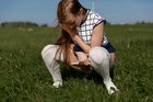 pissing on the field with her panties down