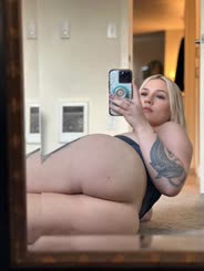 Busty Blonde Takes Selfie in Mirror