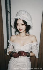 a woman in a white dress and a hat 