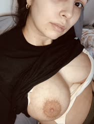 Naked and Busty: A Selfie of a Curvy Woman with Large Breasts