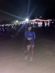Nighttime Concert Adventure: Blue Top and Sneakers