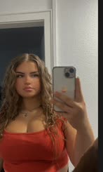  Woman takes selfie of herself in mirror with iPhone