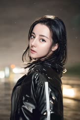 a beautiful young lady in a black jacket
