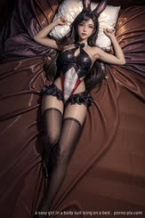 a sexy girl in a body suit lying on a bed . 