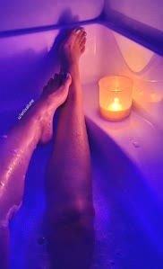 Relaxing in a warm bath while it's storming outside
