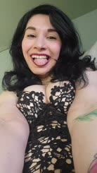 Sexy Black lace dress photo of a woman with a tongue sticking out